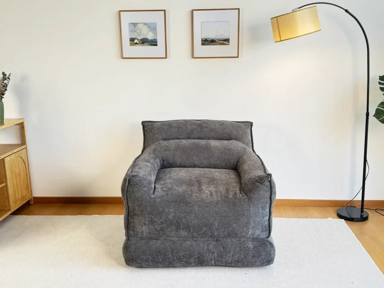 Gray folding and compressible sofa, cloud-shaped sofa with a minimalist design.