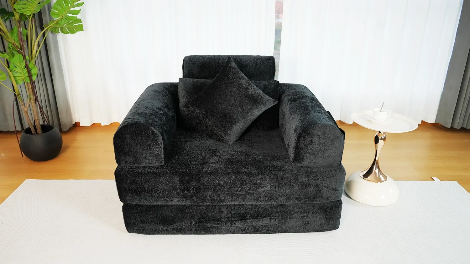 Black folding and compressible sofa, a single-person compressible sofa that can be laid flat.