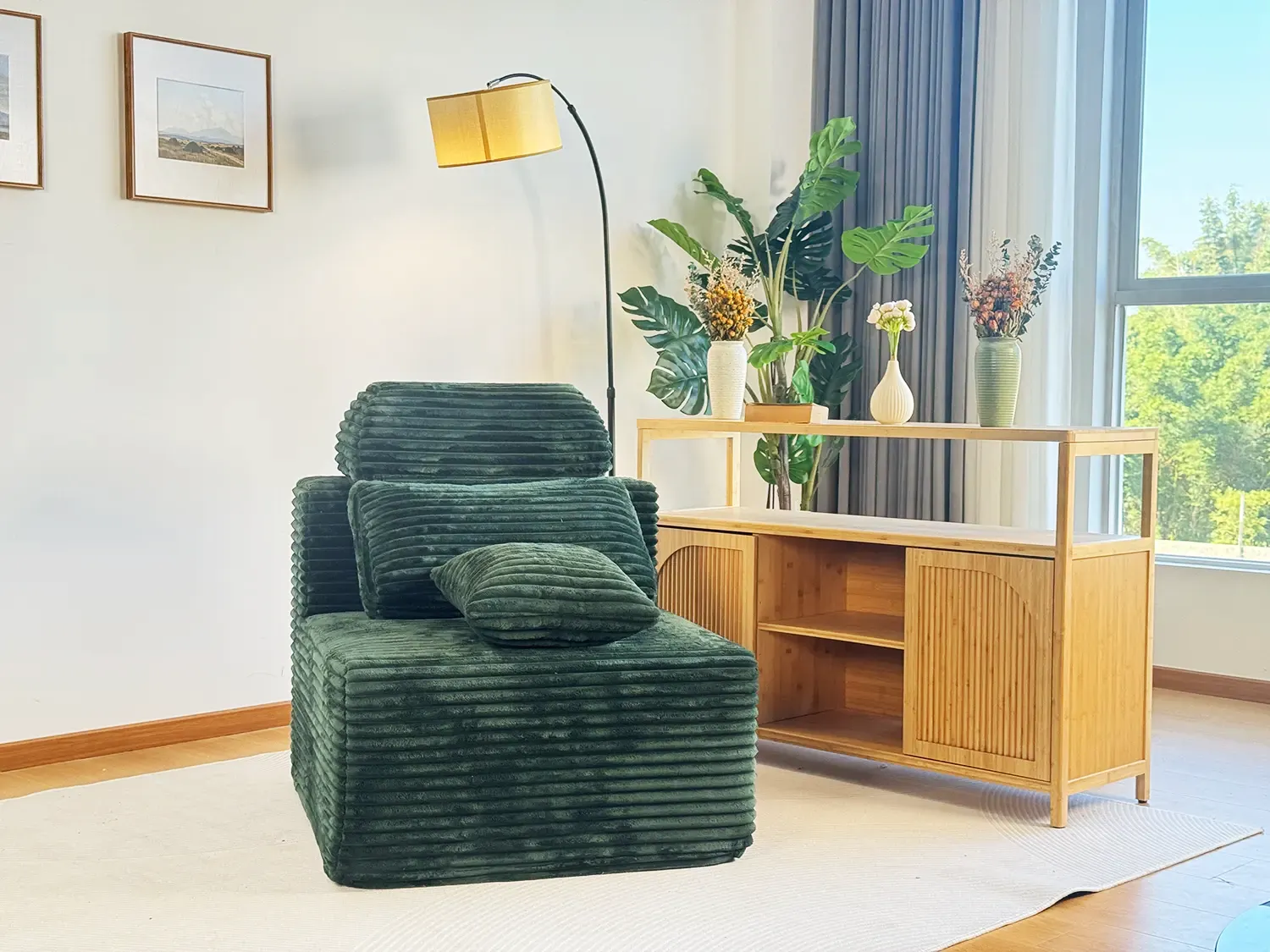 Black plush single seater folding sofa chair with side storage pocket and armrests for small room.