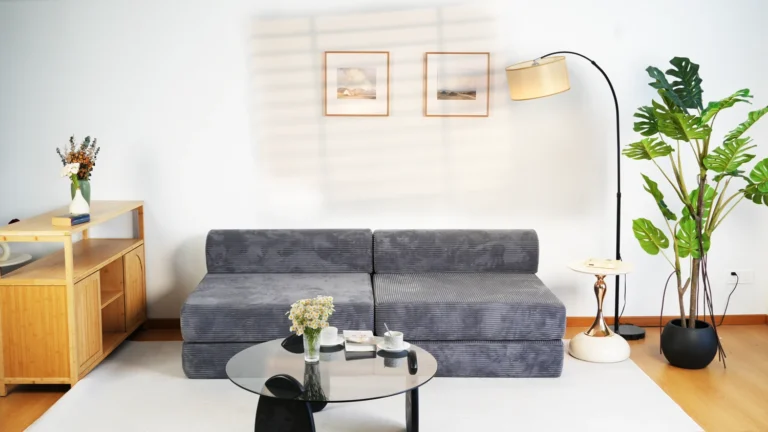 Dark grey corduroy modular compression sofa - four-seater, space-saving design for modern living rooms