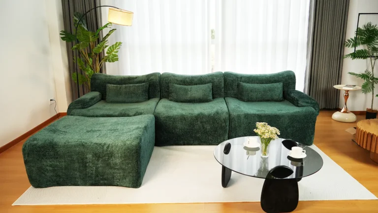 Emerald green boucle L-shaped modular sofa - curved silhouette, plush fabric for modern cozy living rooms